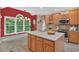 Bright kitchen featuring an island, stainless appliances, and a cozy breakfast area with great views at 9 Monteith Ct, Durham, NC 27713