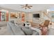 Open-concept living room with tile floors, a comfortable sofa, and an adjoining kitchen at 9 Monteith Ct, Durham, NC 27713