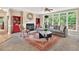 Cozy living room with fireplace, large windows, and decorative rug creating a warm ambiance at 9 Monteith Ct, Durham, NC 27713
