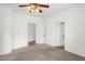 Bright bedroom featuring a ceiling fan and two entrances, perfect for easy access at 907 Morehead Ave, Durham, NC 27707