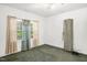 Bright bedroom featuring natural light, large windows, and original trim at 907 Morehead Ave, Durham, NC 27707