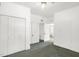 Spacious bedroom featuring ample closet space and doorways with vintage architectural details at 907 Morehead Ave, Durham, NC 27707