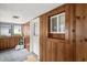 Charming entryway with wood paneling and natural light, creating a welcoming atmosphere at 907 Morehead Ave, Durham, NC 27707