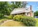 Charming home with lush greenery, and a welcoming front porch offers curb appeal at 907 Morehead Ave, Durham, NC 27707