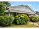 Charming home with lush greenery, and a welcoming front porch offers curb appeal at 907 Morehead Ave, Durham, NC 27707