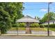 Charming home with lush greenery, and a welcoming front porch in a serene neighborhood at 907 Morehead Ave, Durham, NC 27707