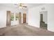 Spacious living room featuring neutral walls, and a ceiling fan at 907 Morehead Ave, Durham, NC 27707
