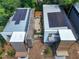 Stunning aerial view of modern homes featuring solar panels and a cozy outdoor lounge area at 922 Tower St, Raleigh, NC 27607