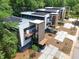 Bird's eye view of stylish, modern homes with solar panels, balconies, and landscaped yards at 922 Tower St, Raleigh, NC 27607