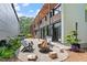 Beautiful backyard with gravel area, modern patio furniture, and contemporary landscaping at 922 Tower St, Raleigh, NC 27607