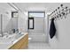 Stylish bathroom featuring a tub, shower, vanity, and modern fixtures with unique towel rack at 922 Tower St, Raleigh, NC 27607