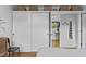Bright bedroom featuring hardwood floors, closet with white sliding doors, and stylish decor at 922 Tower St, Raleigh, NC 27607