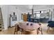 Open-concept dining area with modern light fixture and kitchen view at 922 Tower St, Raleigh, NC 27607