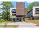 Modern home with striking wood accents, covered parking, and a meticulously designed landscape at 922 Tower St, Raleigh, NC 27607