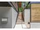 Exterior wooden staircase that leads to a modern, custom-built home at 922 Tower St, Raleigh, NC 27607