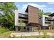 Charming modern home featuring a covered parking area, balconies, and contemporary design elements at 922 Tower St, Raleigh, NC 27607