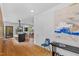 Hallway with a view into the kitchen with modern appliances, and dining area beyond at 922 Tower St, Raleigh, NC 27607