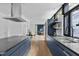Spacious kitchen with stainless steel appliances and hardwood floors at 922 Tower St, Raleigh, NC 27607