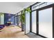 Bright open living area featuring hardwood floors, large windows, and a modern workspace at 922 Tower St, Raleigh, NC 27607