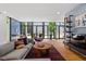 Bright living room featuring modern furniture, hardwood floors, and access to the outdoor area at 922 Tower St, Raleigh, NC 27607