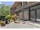 Chic backyard patio with modern lounge chair, minimalist landscaping, and wooden details at 922 Tower St, Raleigh, NC 27607