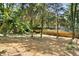 A view of the yard, fence, and mature trees defining the property's boundary at 9416 Buggy Run Cir, Wake Forest, NC 27587