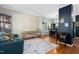 Inviting living room featuring hardwood floors, elegant furnishings, and a seamless transition into the dining area at 9416 Buggy Run Cir, Wake Forest, NC 27587