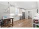 Bright kitchen features stainless steel appliances, granite countertops, subway tile backsplash, and wood flooring at 1004 Snow Peak Ct, Raleigh, NC 27603