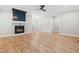 Spacious living room with a fireplace, wood flooring, and modern design at 1004 Snow Peak Ct, Raleigh, NC 27603