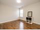 Bright bedroom featuring hardwood floors, natural light, and modern accents at 1035 Evening Shade Ave, Rolesville, NC 27571