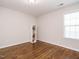 Cozy bedroom with hardwood floors and built-in shelving at 1035 Evening Shade Ave, Rolesville, NC 27571