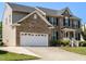 Beautiful two-story brick home with a two-car garage and well maintained landscaping at 1035 Evening Shade Ave, Rolesville, NC 27571