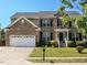 Charming two-story brick home with a well-manicured lawn and a two-car garage at 1035 Evening Shade Ave, Rolesville, NC 27571