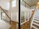 Elegant foyer featuring hardwood floors, a staircase, and an abundance of natural light at 1035 Evening Shade Ave, Rolesville, NC 27571