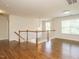 Bright and airy hallway with hardwood floors and access to multiple rooms at 1035 Evening Shade Ave, Rolesville, NC 27571