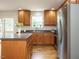Kitchen with stainless steel appliances, granite countertops, and wooden cabinetry at 1035 Evening Shade Ave, Rolesville, NC 27571
