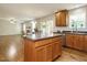 Kitchen with island, stainless appliances, view to living area and open concept layout at 1035 Evening Shade Ave, Rolesville, NC 27571