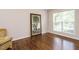 Spacious living room featuring hardwood floors, a large window, and neutral walls at 1035 Evening Shade Ave, Rolesville, NC 27571