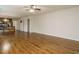 Spacious living area with hardwood flooring, open floorplan, and view to kitchen at 1035 Evening Shade Ave, Rolesville, NC 27571