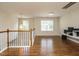 Bright loft area with hardwood floors, perfect for relaxation or entertainment at 1035 Evening Shade Ave, Rolesville, NC 27571