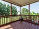 Inviting screened-in porch with wood floors and backyard views at 1035 Evening Shade Ave, Rolesville, NC 27571
