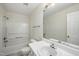 Clean, bright bathroom with white fixtures, a shower and tub combination, and a single sink at 110 Virens Dr, Cary, NC 27511