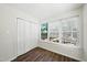 Sunlit bedroom featuring a closet and windows with blinds, offering a cozy space with natural light at 110 Virens Dr, Cary, NC 27511