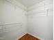 Walk-in closet with wood floors, wire shelving, and white walls at 110 Virens Dr, Cary, NC 27511