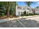 Charming townhouse with blue door, shuttered windows, and well-maintained landscaping near ample parking at 110 Virens Dr, Cary, NC 27511