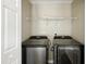 Convenient laundry area featuring a washer and dryer hookups and a wire shelf, making laundry days a breeze at 110 Virens Dr, Cary, NC 27511