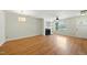 Inviting living room with hardwood floors, fireplace, and natural light from the large windows and a ceiling fan at 110 Virens Dr, Cary, NC 27511