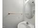 Clean, well-lit powder room with a corner sink and a decorative mirror, offering a functional space at 110 Virens Dr, Cary, NC 27511