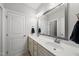 Bathroom featuring double sinks, and white cabinetry at 1123 Ambrose Dr, Rolesville, NC 27571
