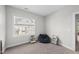 Neutral bedroom with a beanbag chair and natural light from the large window at 1123 Ambrose Dr, Rolesville, NC 27571